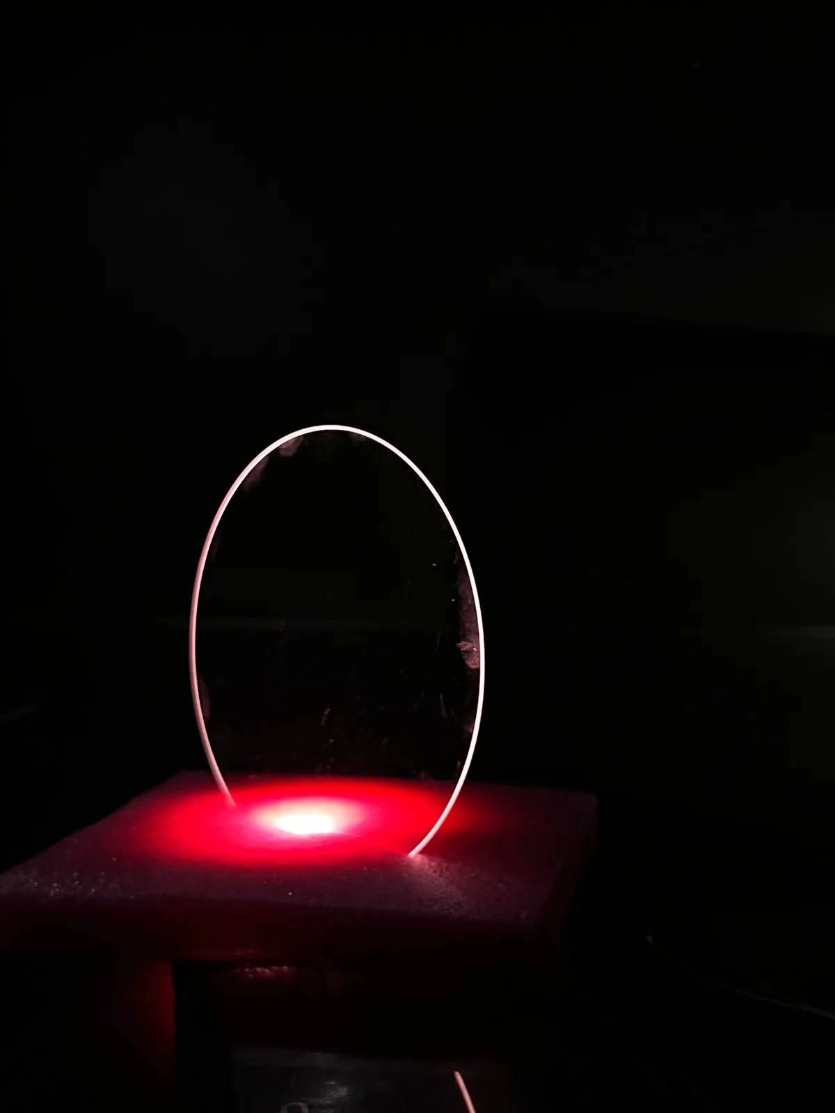 Polished sapphire wafer under light