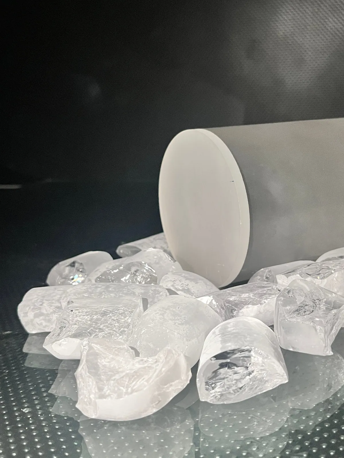 Sapphire ingot and crystal pieces